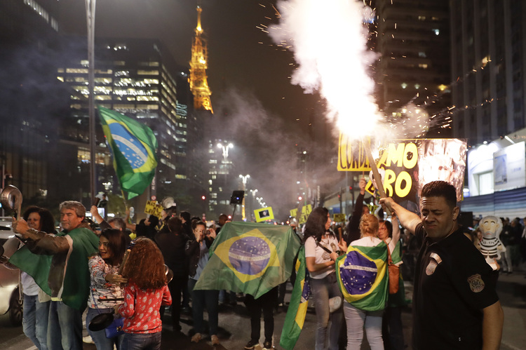 Demonstrators celebrated in Sao Paulo overnight the conviction of former Brazilian President Luiz Inacio Lula da Silva on corruption. (Andre Penner/AP)  