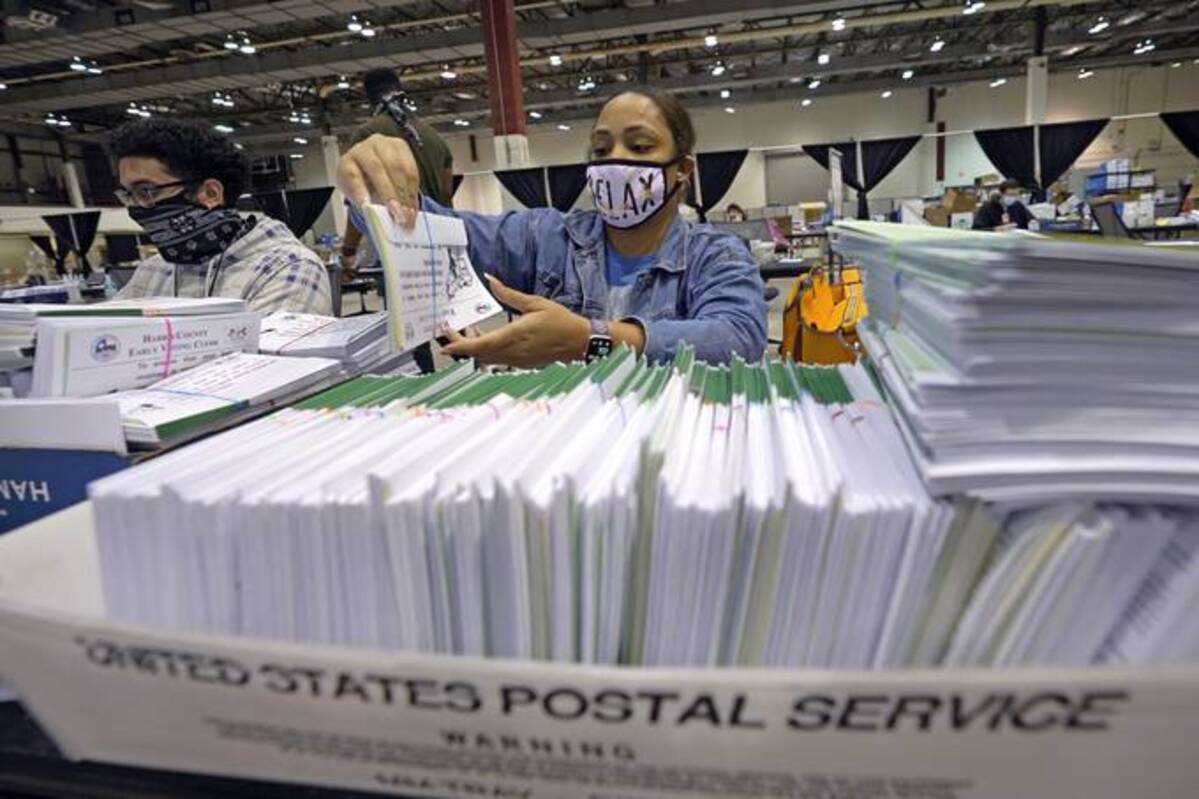 Harris County, Tex., election workers prepare mail ballots for the 2020 election. (David J. Phillip/AP)