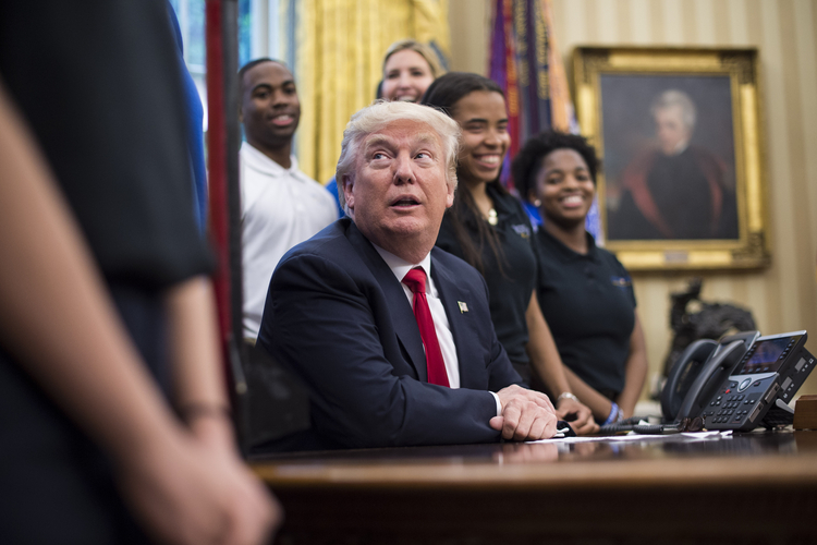 President Donald Trump speaks to students in the Oval Office last Friday. (Jabin Botsford/The Washington Post)</p>  