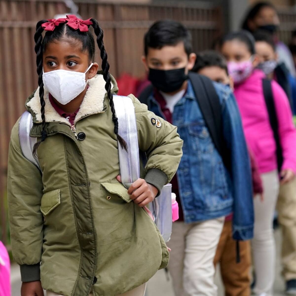 Students line up to enter an elementary school in Jersey City last year. (Seth Wenig/AP)