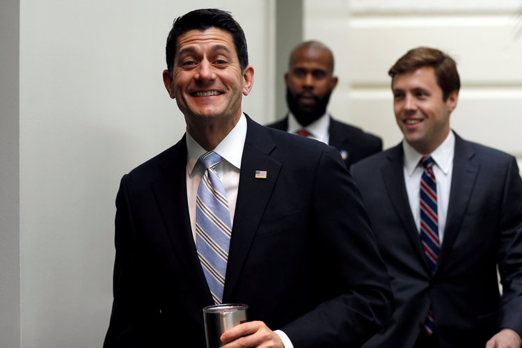 Paul Ryan smiles as he arrives for a caucus meeting with House Republicans yesterday. (Jonathan Ernst/Reuters)</p>  