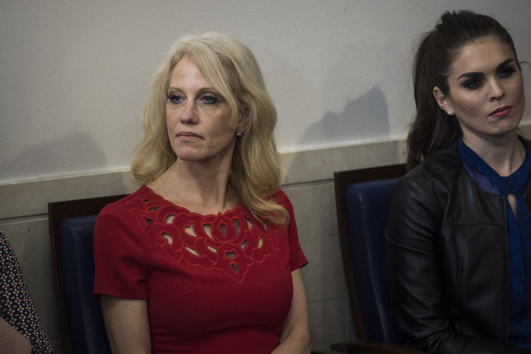 Kellyanne Conway, left, and Hope Hicks, right, listen during Sean Spicer's briefing yesterday. (Jabin Botsford/The Washington Post)</p>  