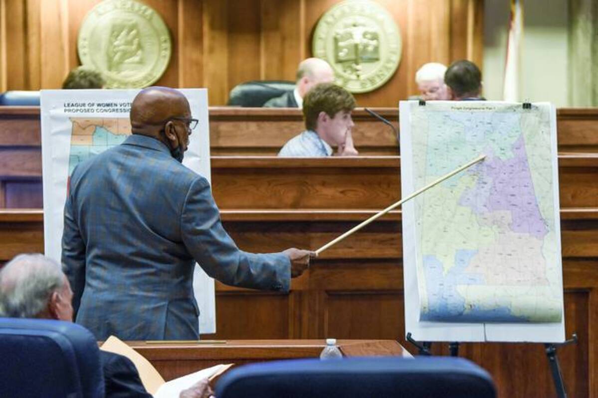 State Sen. Rodger Smitherman compares U.S. Representative district maps during a special session on redistricting at the Alabama Statehouse in Montgomery, Ala., Nov. 3, 2021. (Mickey Welsh/The Montgomery Advertiser via AP, File)