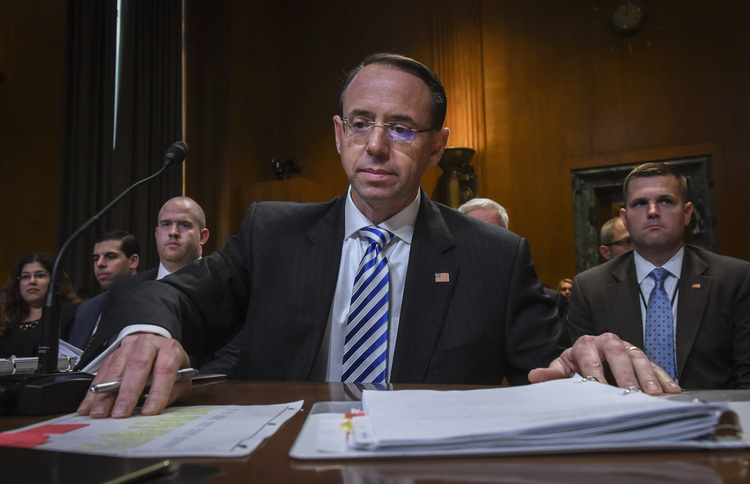 Rod Rosenstein sorts through notes as he testifies before a Senate Appropriations subcommittee this week. (Bill O'Leary/The Washington Post)</p>  
