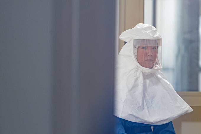 Elena Lian, a Colorado State University scientist, studies potential coronavirus treatments in a biosafety level-3 laboratory. (William A. Cotton/CSU Photography)