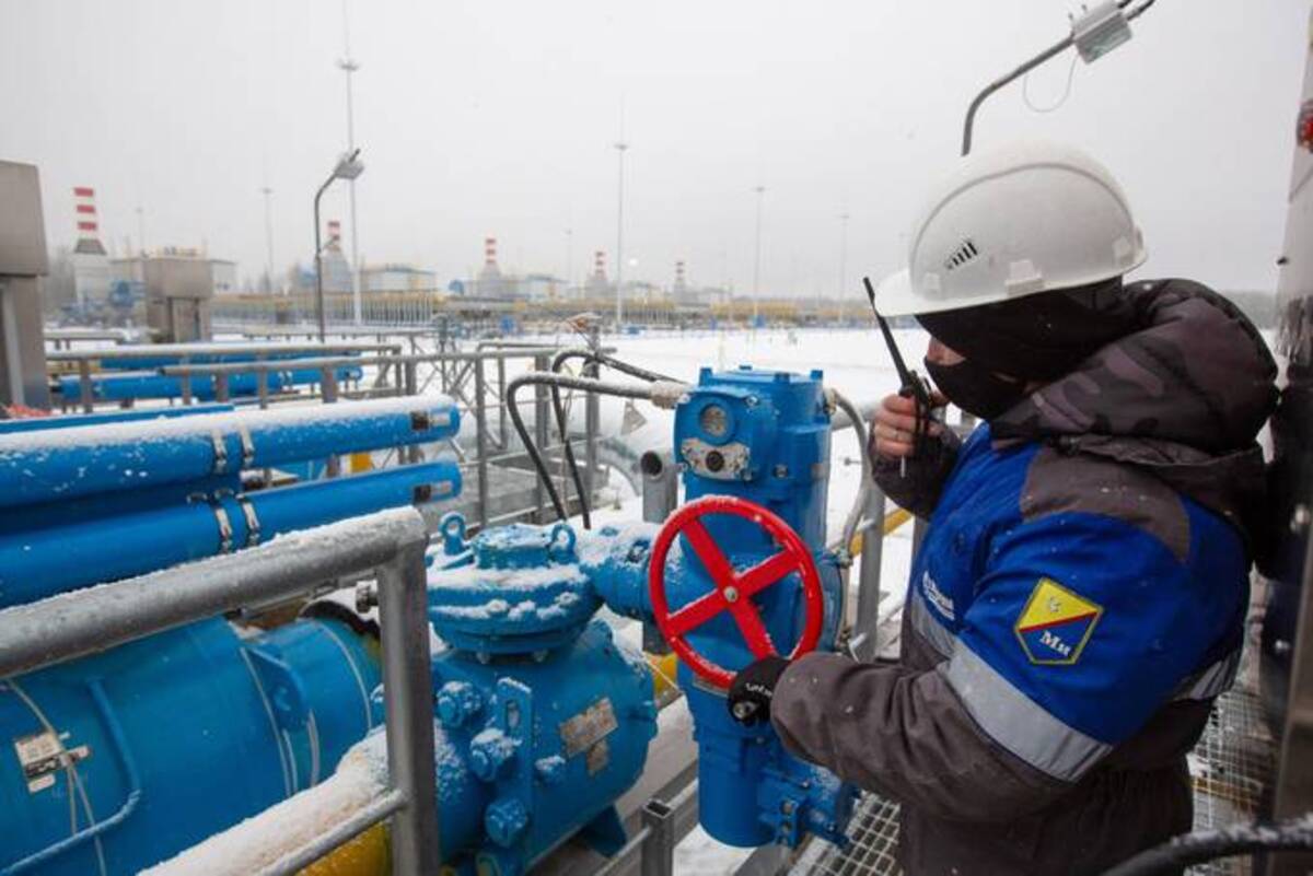 A worker adjusts a valve at the starting point of the Nord Stream 2 gas pipeline. (Andrey Rudakov/Bloomberg News)