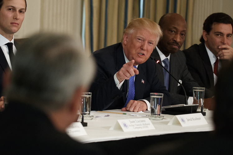 Trump speaks to business leaders, including Merck CEO Kenneth Frazier, at the White House. (Evan Vucci/AP)  
