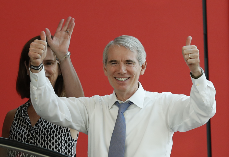 Sen. Rob Portman (R-Ohio) and his wife celebrate&nbsp;an&nbsp;endorsement last month from a union that had previously backed his Democratic rival.&nbsp;(Alex Brandon/AP)</p>  