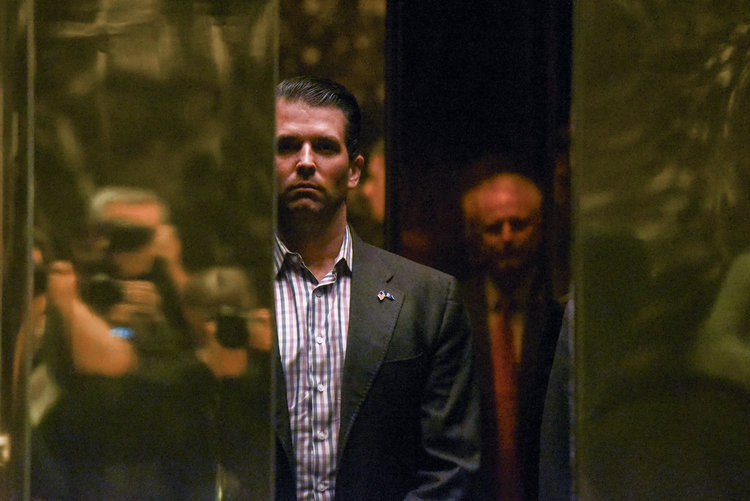 Donald Trump Jr. rides the elevator at Trump Tower in New York City during the transition. (Stephanie Keith/Reuters)  