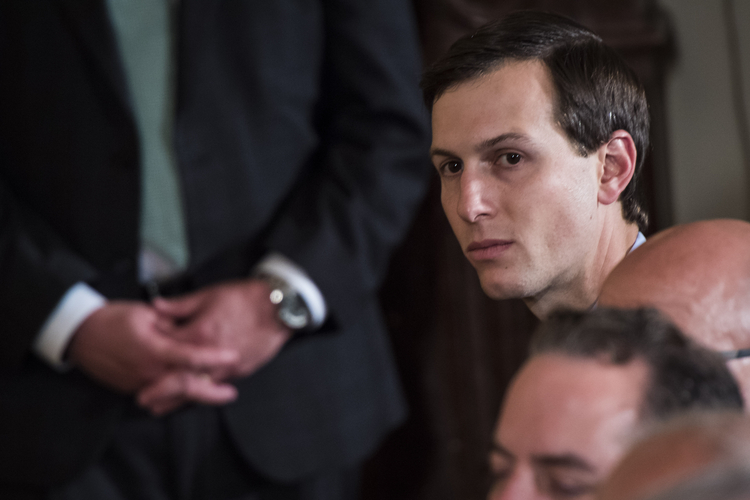 Jared Kushner listens to his father-in-law speak during a news conference at the White House. (Jabin Botsford/The Washington Post)  