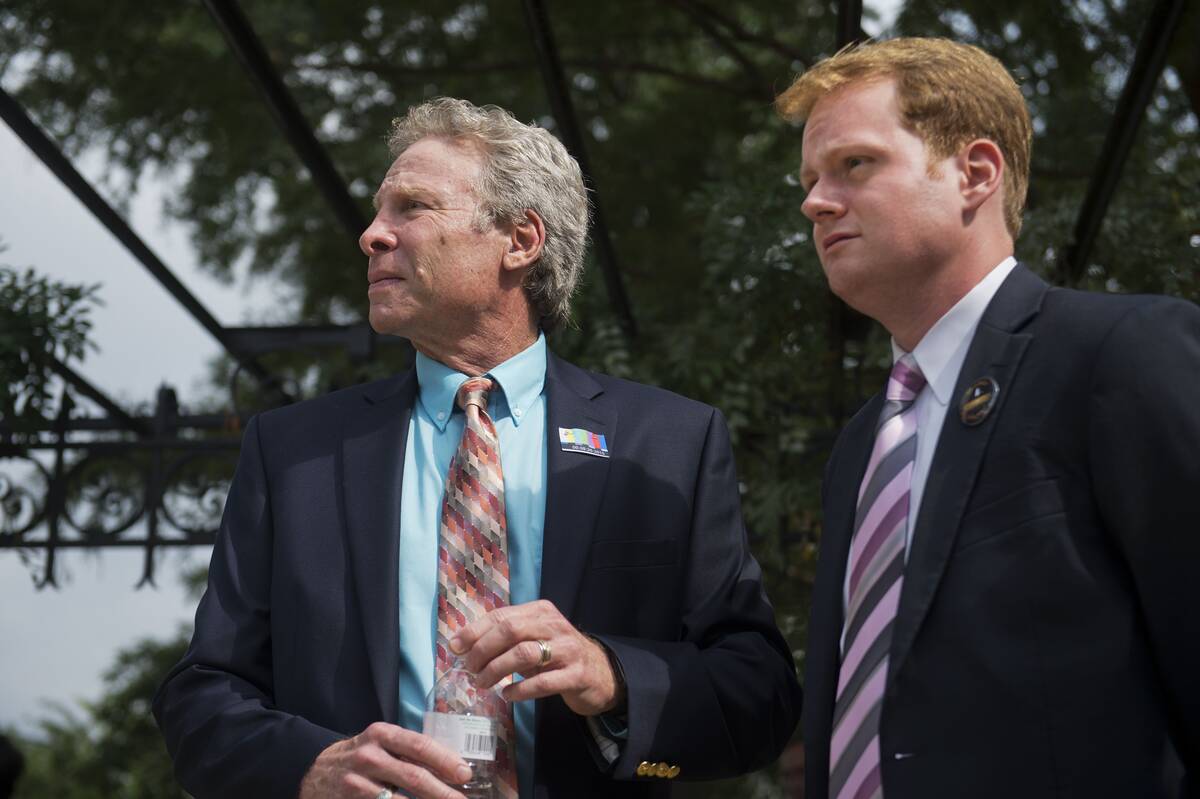 Andy Parker, left, whose daughter Alison, a reporter for WDBJ-TV reporter, was killed on air, and her boyfriend Chris Hurst, attend a rally on the East Front lawn of the Capitol to demand that Congress take action on gun control legislation, Sept. 10, 2015. (Tom Williams/CQ Roll Call)
