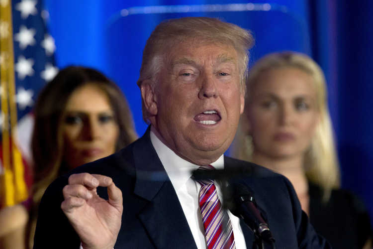 Donald Trump reads from a&nbsp;teleprompter Tuesday night at his golf club&nbsp;in Westchester.&nbsp;(AP Photo/Mary Altaffer)</p>  