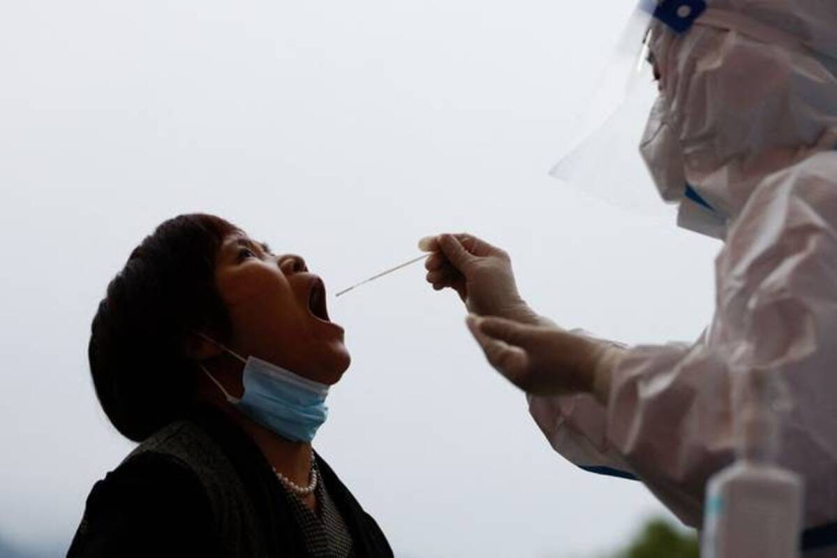 A woman gets tested for the coronavirus. (Carlos Garcia Rawlins/Reuters)