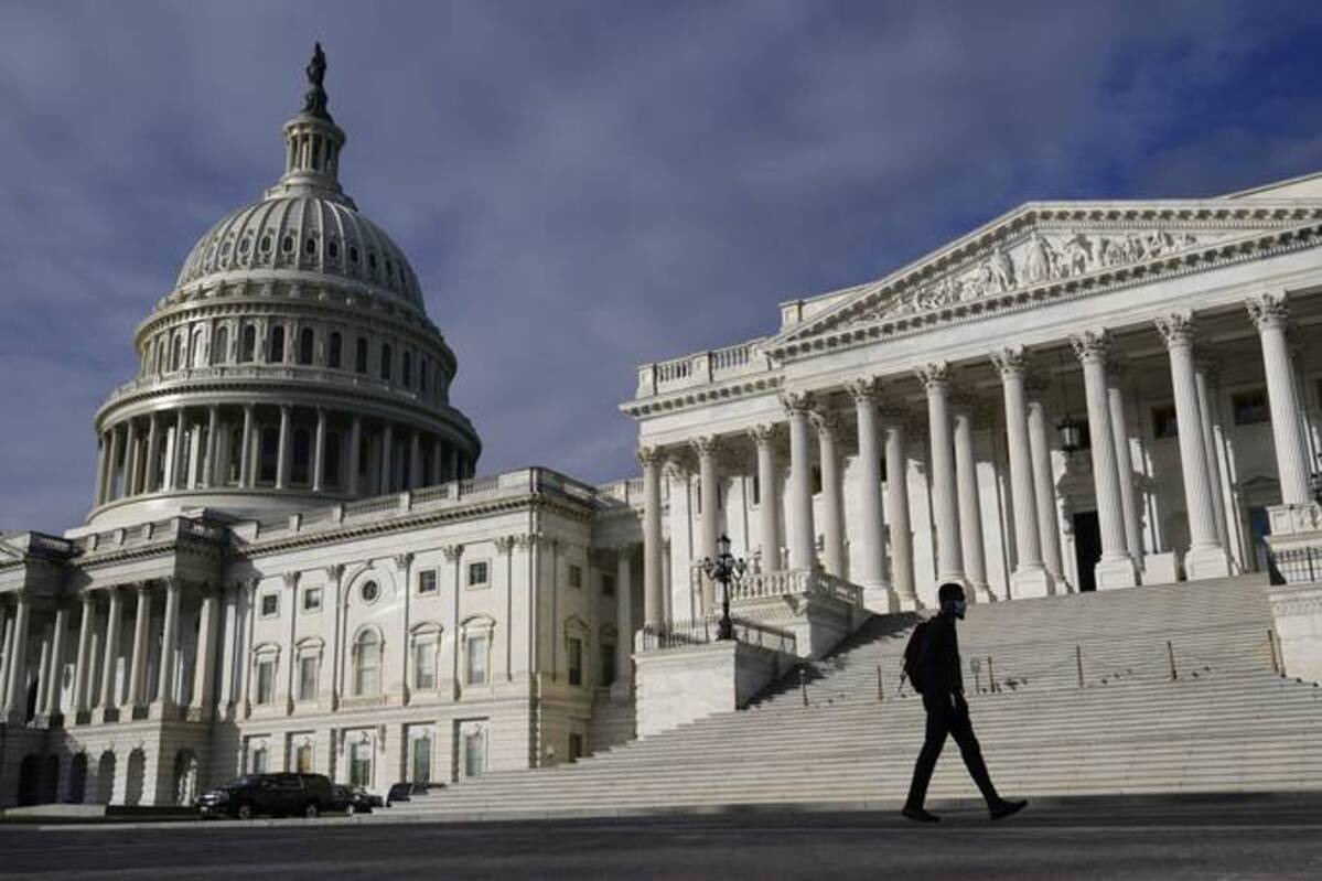 A man walks past the U.S. Capitol, Wednesday on Capitol Hill in Washington. (Patrick Semansky/AP)