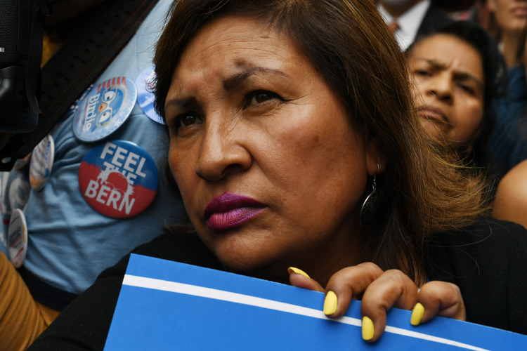 A supporter&nbsp;listens to Bernie in San Francisco last night. (Photo by Matt McClain/ The Washington Post)</p>  