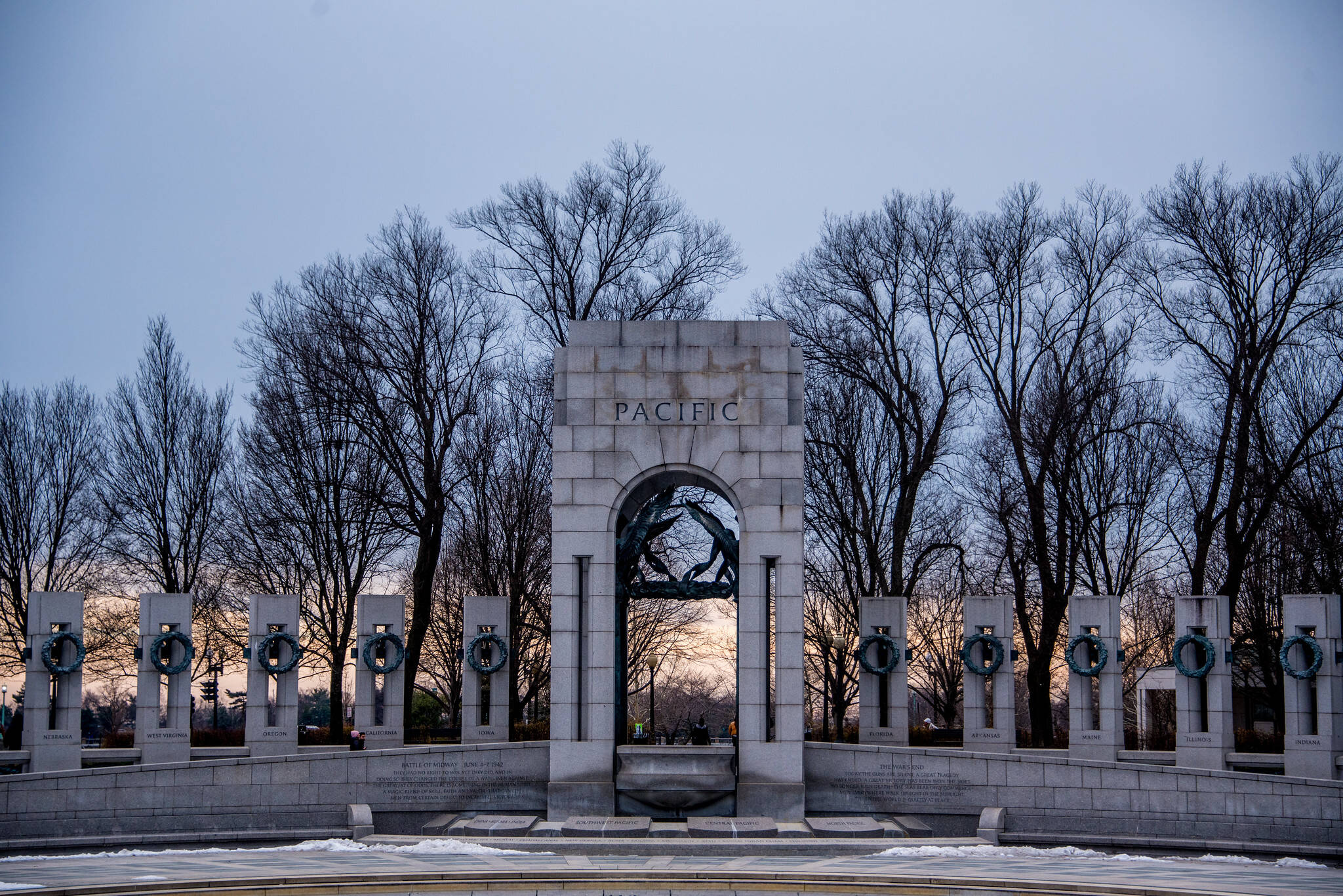 The World War II Memorial with some color low in the sky on Sunday.