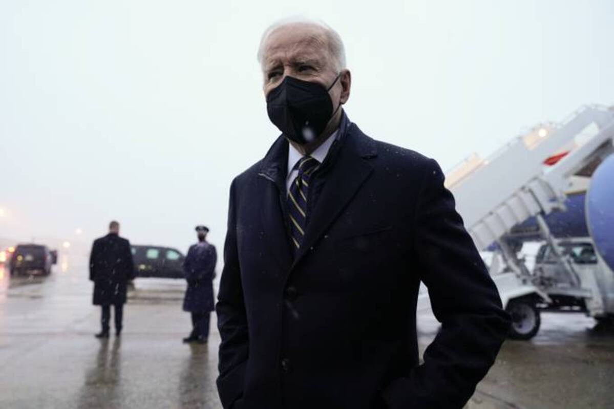 President Biden speaks to reporters as he arrives at Andrews Air Force Base on Friday. (Andrew Harnik/AP)