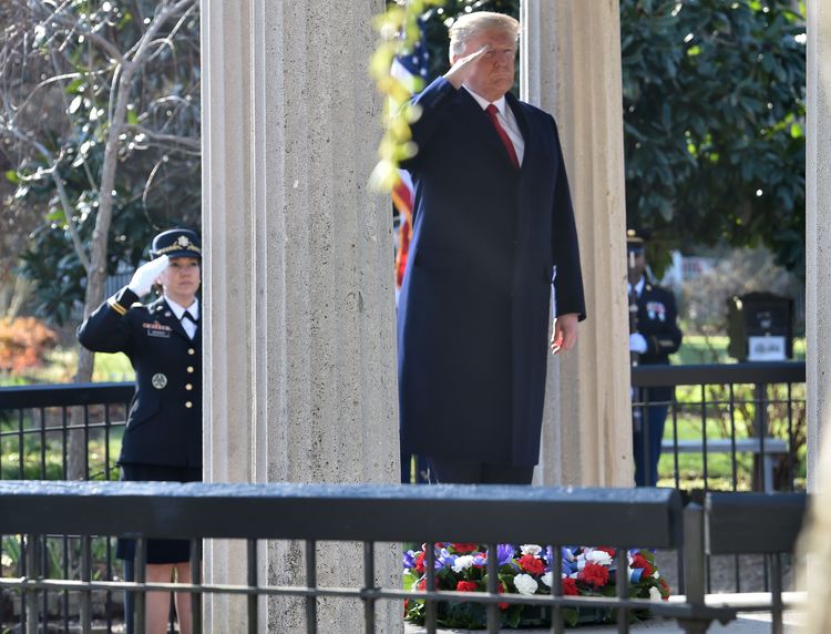 Donald Trump salutes after laying a wreath at the tomb of Andrew Jackson after touring The Hermitage in Nashville on March 15. (Nicholas Kamm/AFP/Getty Images)</p>  
