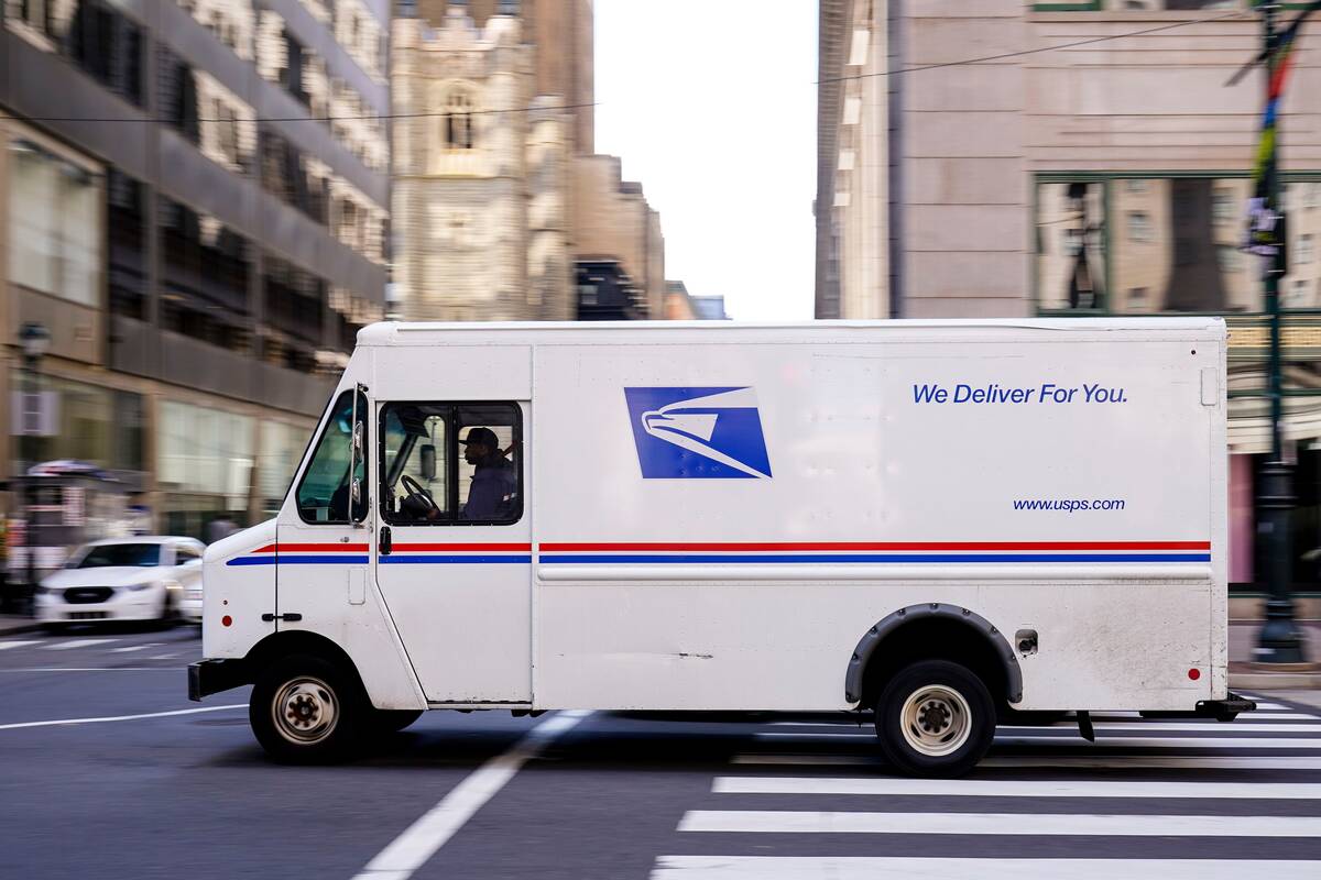 A United States Postal Service truck drives in Philadelphia, on Thursday, March 3. (Matt Rourke/AP Photo)