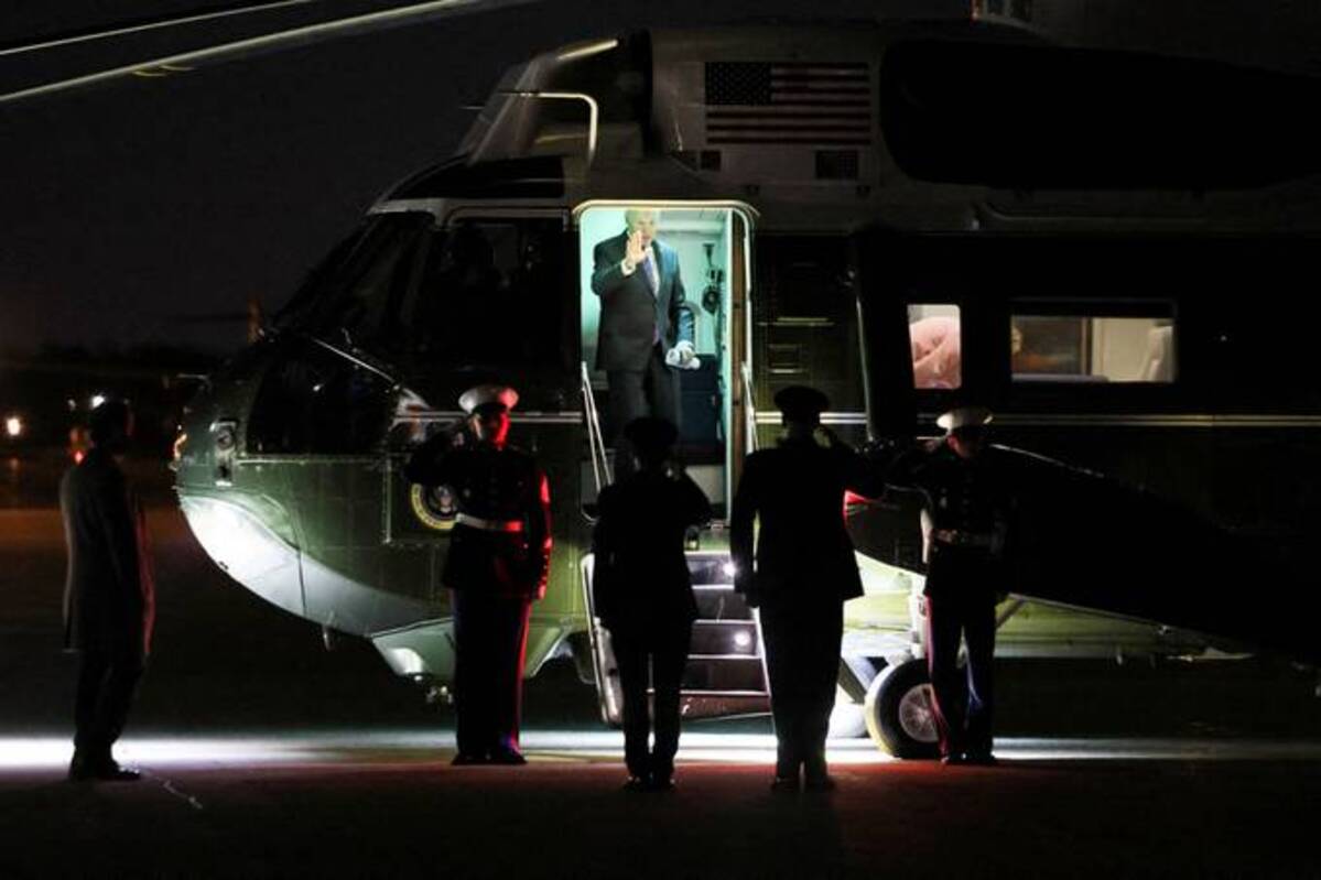 President Biden boards Marine One after returning from Wisconsin on Wednesday. (Evelyn Hockstein/Reuters)