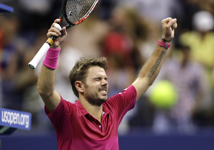 Stan Wawrinka&nbsp;celebrates&nbsp;last night.&nbsp;(Charles Krupa/AP)</p>  