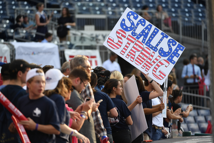 Fans hold up signs supporting Steve Scalise&nbsp;during last night's game. (Jonathan Newton/The Washington Post)</p>  
