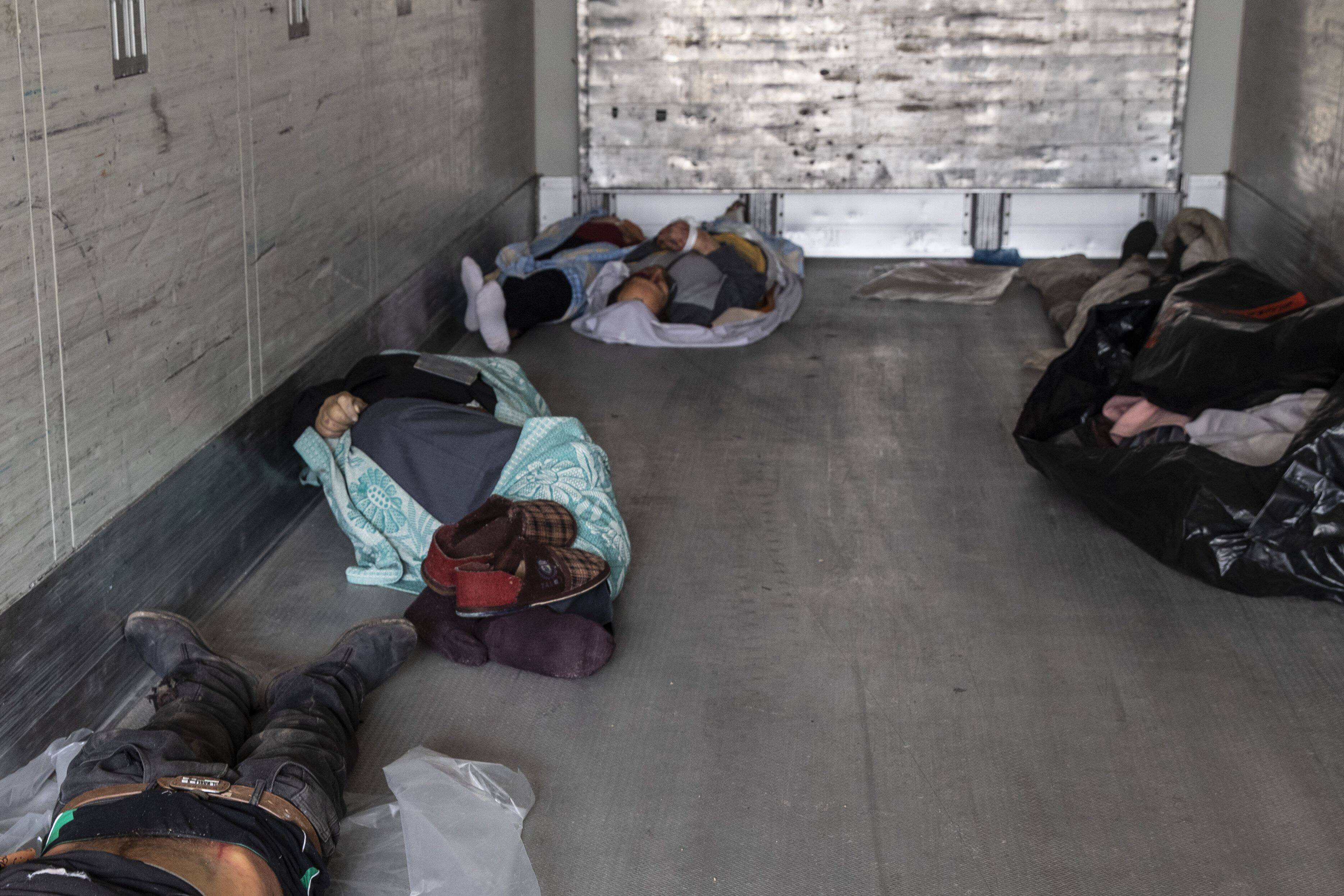 Unclaimed bodies lie in a refrigerator truck outside a morgue in Chernihiv, Ukraine, on April 4. (Heidi Levine for The Washington Post)