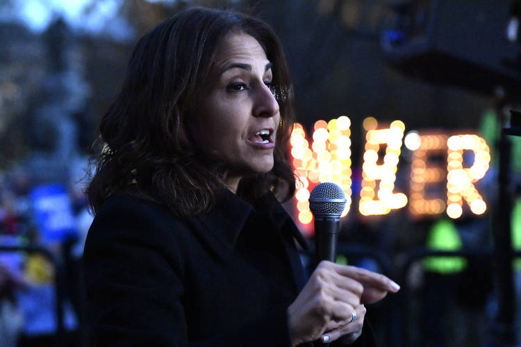 Neera Tanden, who runs the Center for American Progress, speaks at a protest against President Trump last November in Washington. (Larry French/Getty Images for MoveOn)  
