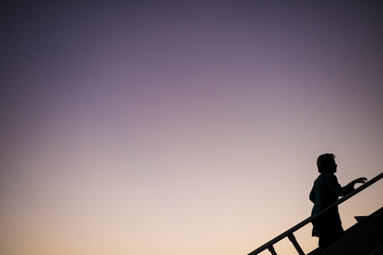 Hillary boards her plane in Cleveland yesterday afternoon, bound for a rally in New Hampshire. (Melina Mara/The Washington Post)</p>  