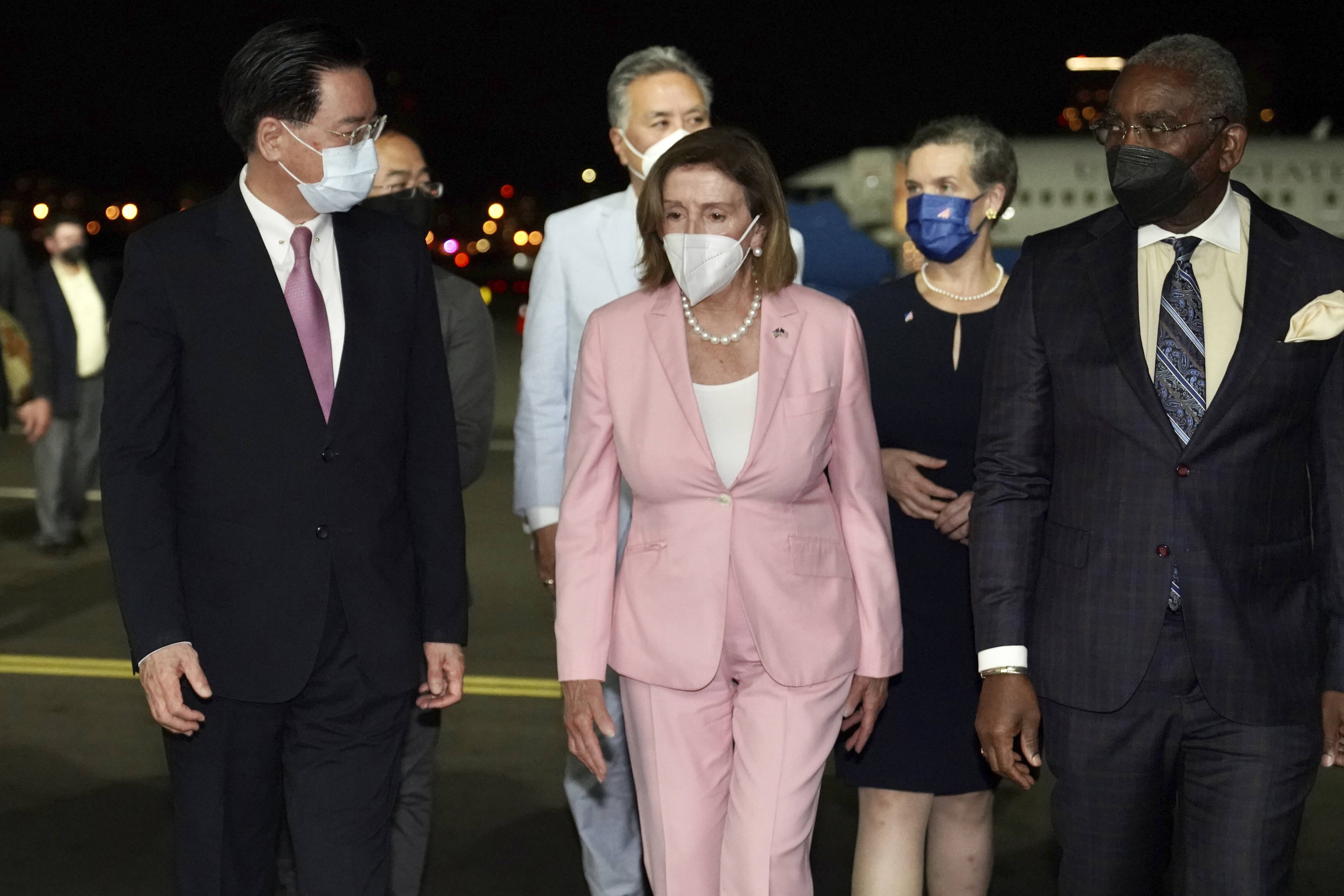 Pelosi with Taiwan Foreign Minister Joseph Wu, left, and other members of Congress on Tuesday in Taipei. (Taiwan Ministry of Foreign Affairs/AP) (AP)