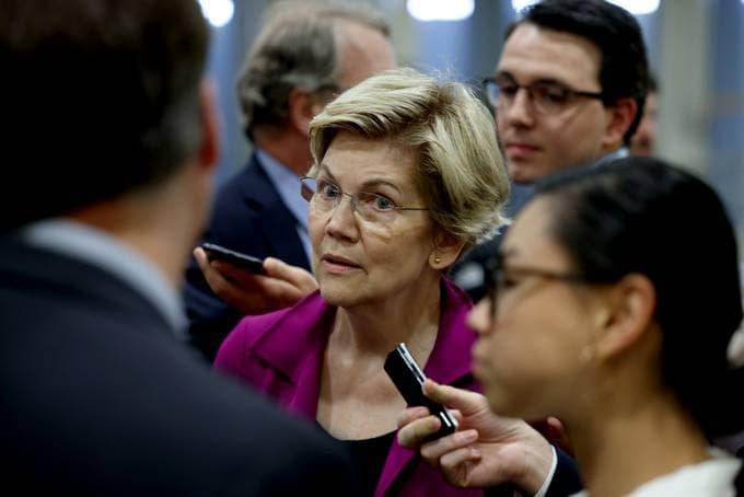 Sen. Elizabeth Warren (D-Mass.) speaks to reporters in the Senate subway. (Photo by Anna Moneymaker/Getty Images)