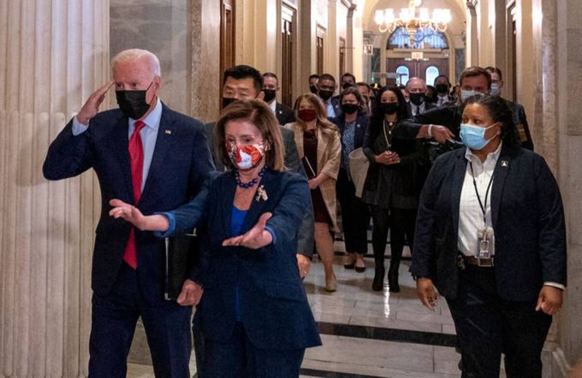Biden and House Speaker Nancy Pelosi (D-Calif.) in the U.S. Capitol Oct. 1. (Andrew Caballero-Reynolds/AFP via Getty Images)