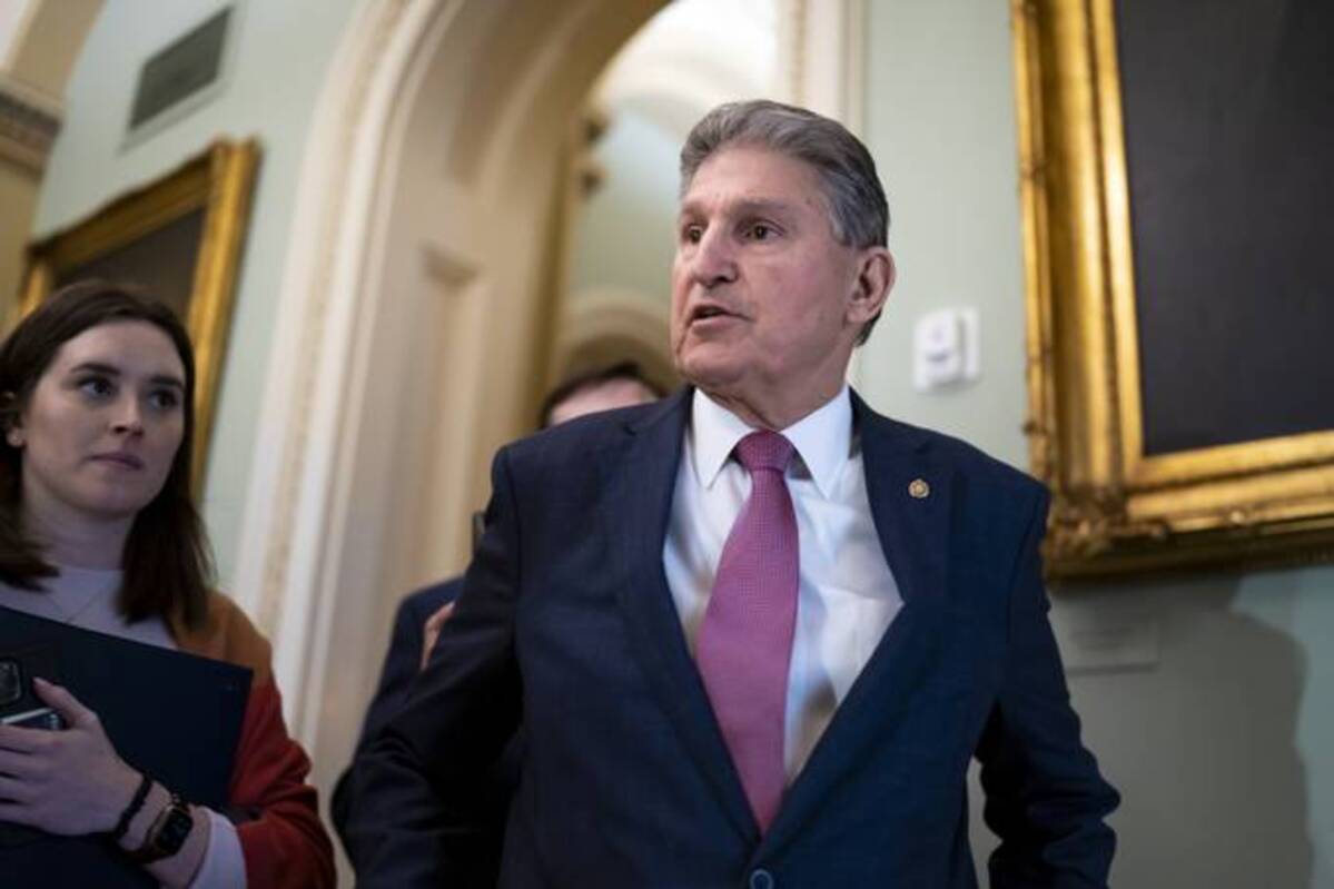 Sen. Joe Manchin III (D-W.Va.) speaks with reporters at the Capitol. (J. Scott Applewhite/AP)