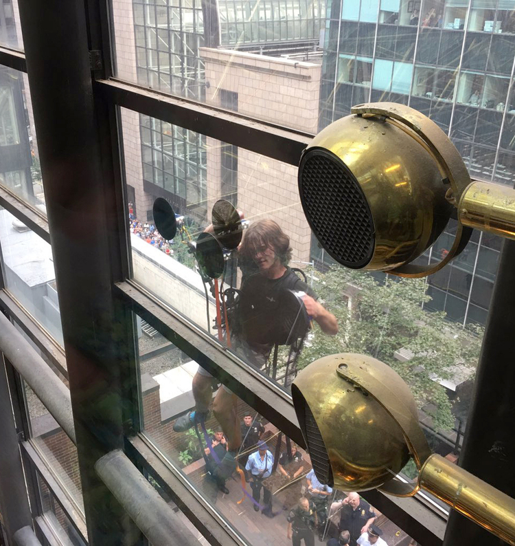 A man scales the 58-story&nbsp;Trump Tower in New York. (Alex Cannon/AP)</p>  
