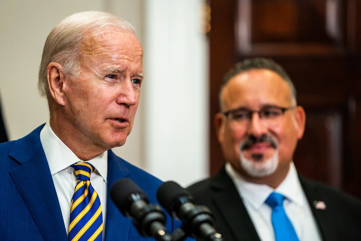 President Biden, accompanied by Education Secretary Miguel Cardona, speaks about student loan forgiveness on Aug. 24 at the White House. (Demetrius Freeman/The Washington Post)