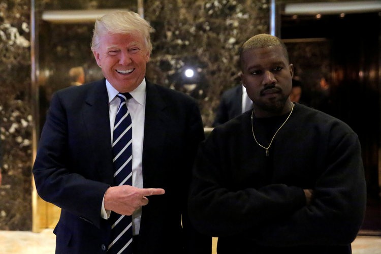 DJT poses with Kanye West in the lobby of Trump Tower last month. (Andrew Kelly/Reuters)</p>  