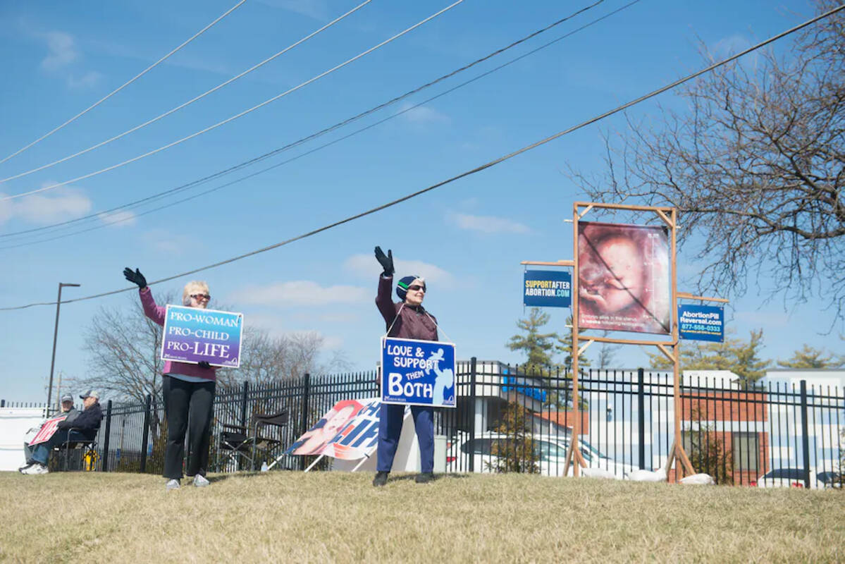Members of the antiabortion group 40 Days for Life protest outside the Planned Parenthood clinic in Fairview Heights, Ill., on March 8. (Neeta Satam for The Washington Post)