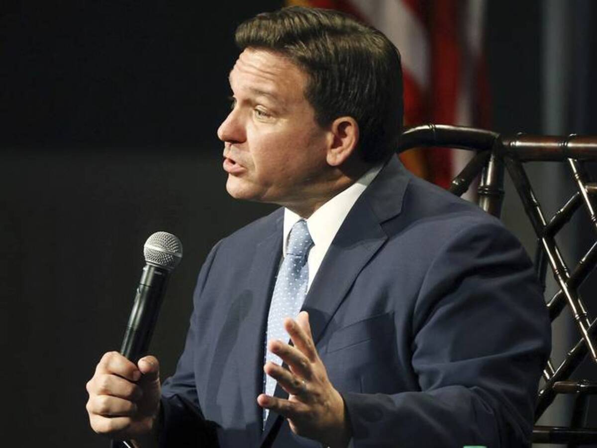 Florida Gov. Ron DeSantis (R) speaks during a "fireside chat" at the Florida chapter of the Federalist Society's annual meeting at Disney's Yacht Club resort in Walt Disney World on Friday. (Stephen M. Dowell/Orlando Sentinel/AP)