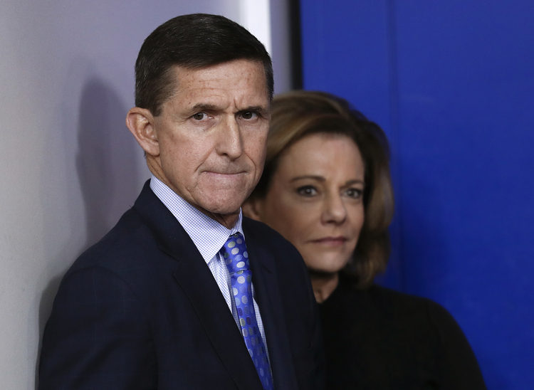 Then-National Security Adviser Michael Flynn, joined by deputy K.T. McFarland, watch Sean Spicer's daily briefing in February. (Carolyn Kaster/AP)</p>  