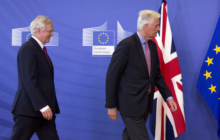 E.U. Chief Brexit Negotiator Michel Barnier and British Secretary of State David Davis prepare to make statements. (Virginia Mayo/AP)</p>  
