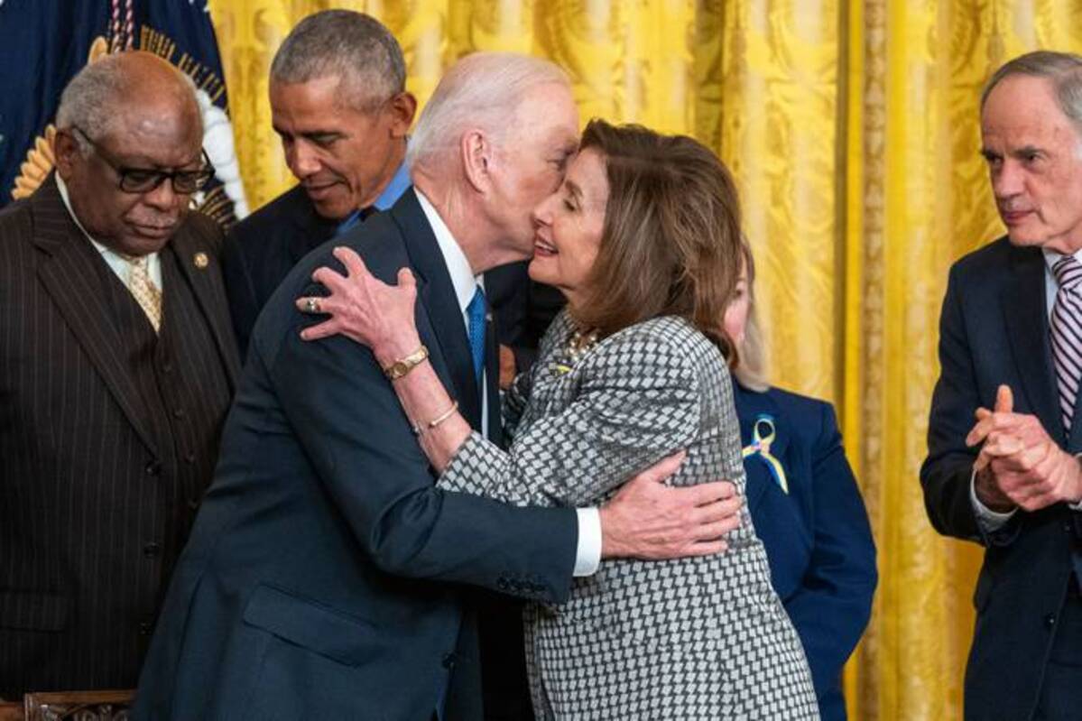 President Biden embraces House Speaker Nancy Pelosi (D-Calif.) following the signing of an executive order to strengthen the Affordable Care Act on Tuesday. (Shawn Thew/EPA-EFE/Shutterstock)