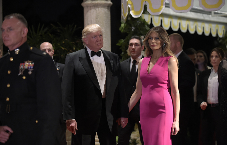 Donald and Melania Trump attend a Red Cross Gala at the Mar-a-Lago resort in Palm Beach in February. (Susan Walsh/AP)</p>  