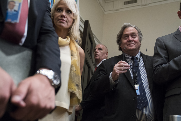 Kellyanne Conway and Steve Bannon wait for Donald Trump to speak about immigration in the Roosevelt Room earlier this month. (Jabin Botsford/The Washington Post)  