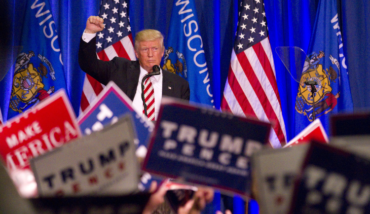 Donald Trump concludes his speech last night in Wisconsin. (John Ehlke/West Bend Daily News via AP)</p>
