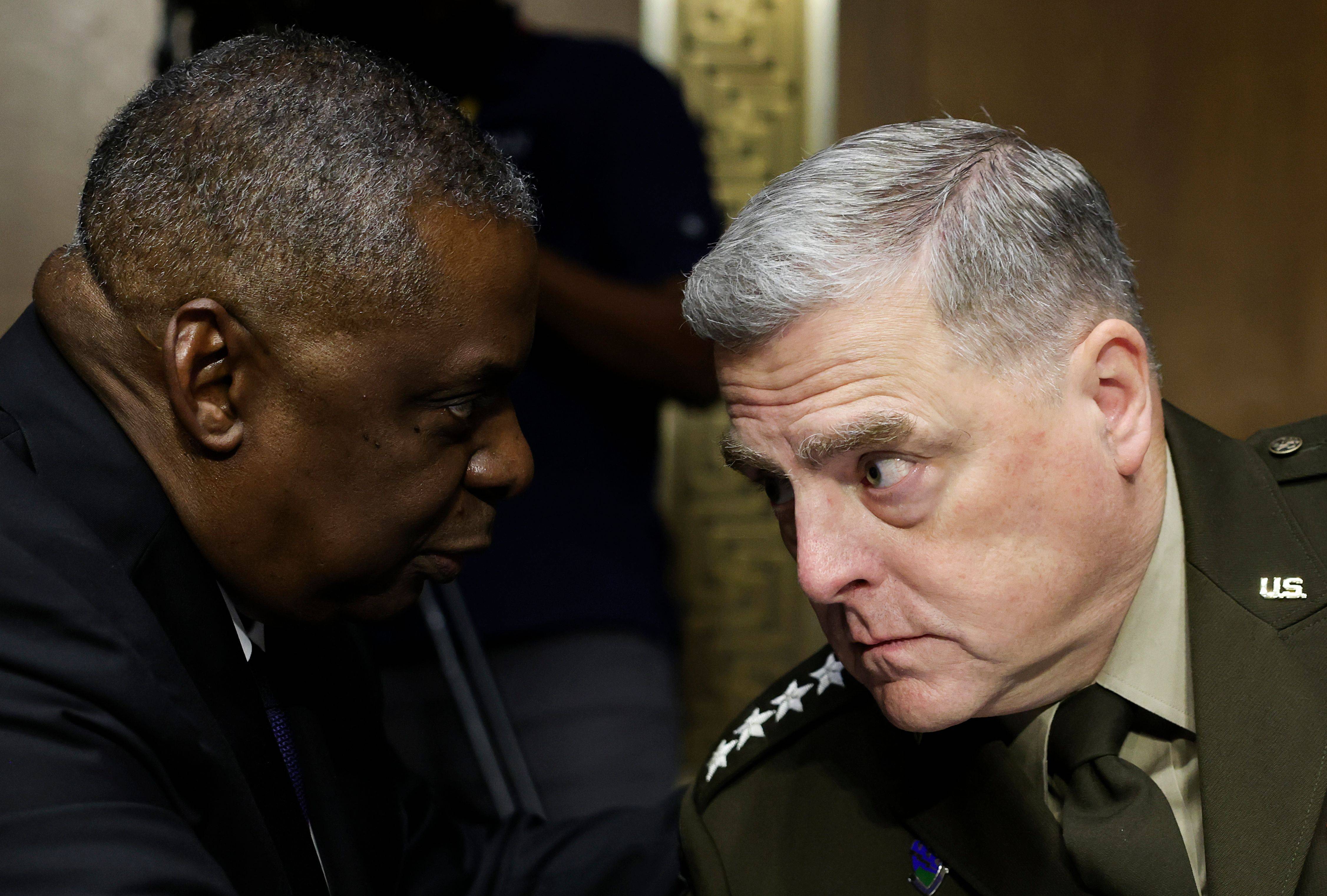 U.S. Defense Secretary Lloyd Austin talks with Joint Chiefs of Staff Chair Gen. Mark Milley during a Senate Appropriations Committee hearing on June 17. (Evelyn Hockstein/Pool/EPA-EFE/Shutterstock)
