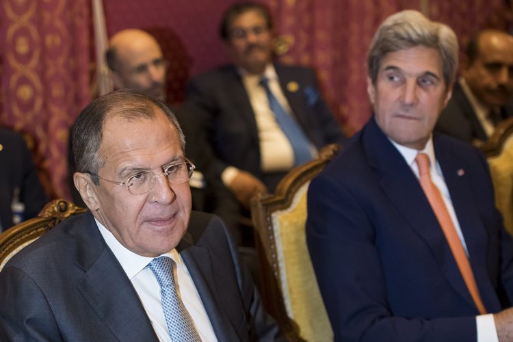 Russian Foreign Minister Sergei Lavrov and John Kerry discuss Syria in October. (Jean-Christophe Bott/EPA)</p>