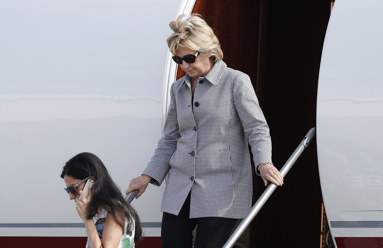 Clinton and&nbsp;Huma Abedin&nbsp;land in Los Angeles yesterday&nbsp;to raise money.&nbsp;(Carolyn Kaster/AP)</p>  