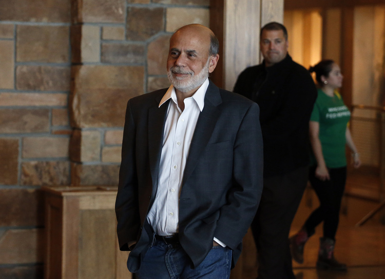 Ben Bernanke hangs out at a reception&nbsp;sponsored by the Federal Reserve Bank of Kansas City in Jackson Hole last month.&nbsp;(Brennan Linsley/AP)</p>  