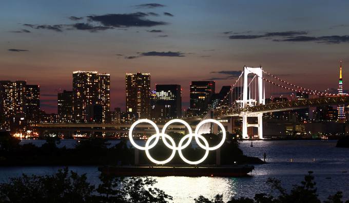 The Olympic Rings at sunset, ahead of the official opening of the Tokyo Games (Kai Pfaffenbach/Reuters)