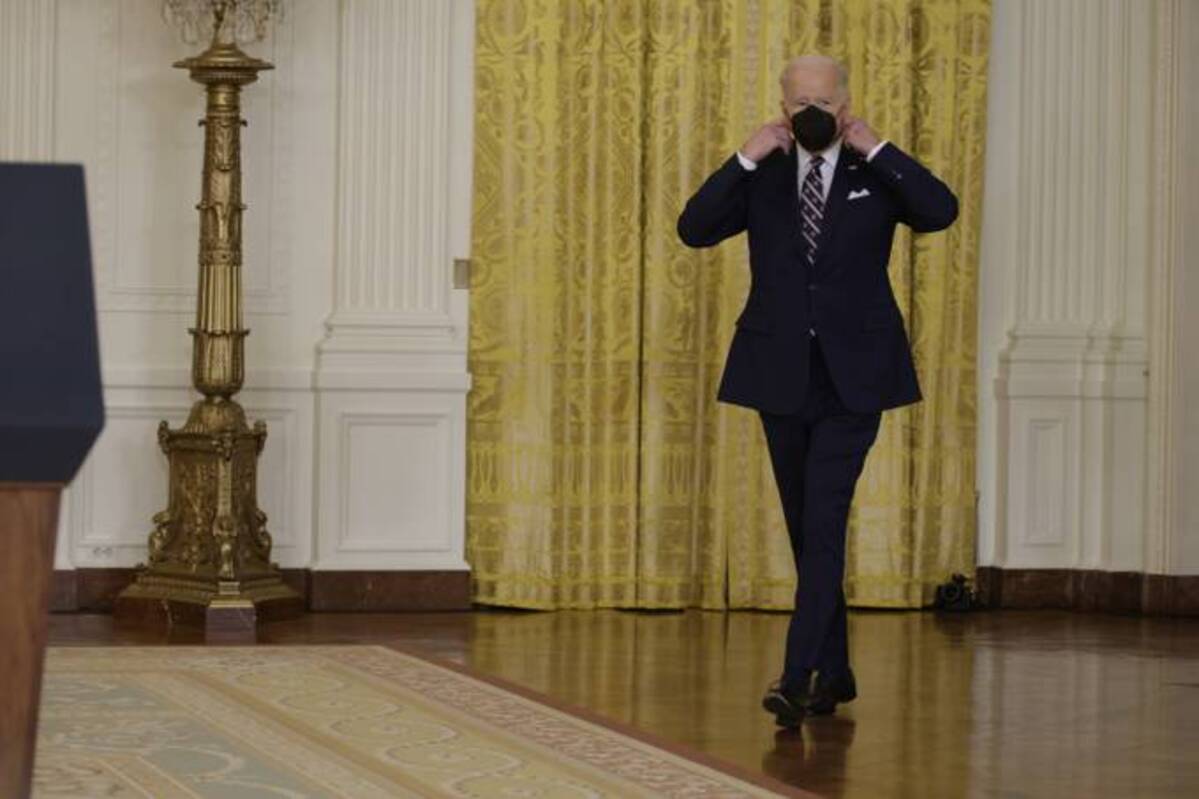 President Biden arrives to speak on Russia and Ukraine in the East Room of the White House on Tuesday. (Samuel Corum/Bloomberg News)